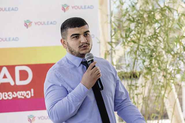 Rashan, an emerging leader in the ethnic Azerbaijani minority community in Georgia, speaking at a youth conference in April / International Republican Institute