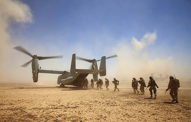 US Marines assigned to Georgian Liaison Team 9, and Georgian soldiers assigned to the 33rd Light Infantry Battalion, board a US Marine Corps MV-22B Osprey during Operation Northern Lion II July 3, 2013, in Helmand province, Afghanistan. Photo by Cpl. Alejandro Pena/United States Marine Corps