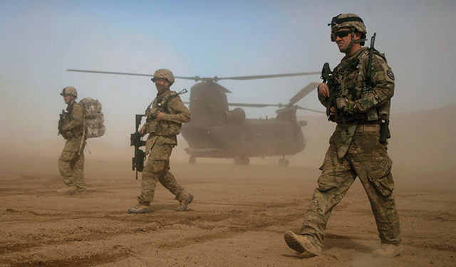 US soldiers, part of the NATO- led International Security Assistance Force (ISAF), walk west of Kabul, Afghanistan, 2012. Source: AP Photo