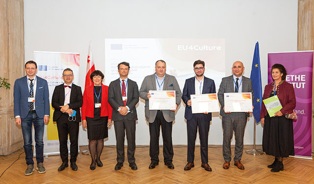 The EU4Culture team and winning mayors collecting their grant certificates