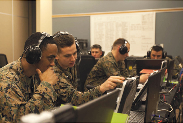 United States Marine Corps Officers conduct tactical training using computer generated wargames during an exercise. Photo by Nicholas P. Baird/U.S. Marine Corps