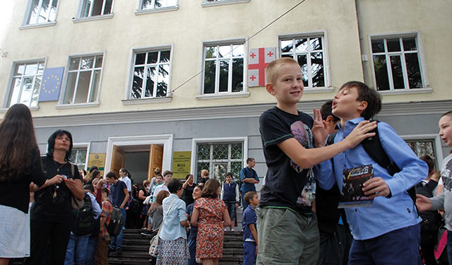 Students and parents exit their school at the end of a school day at a public school in Tbilisi. Photo by Monica Ellena/Eurasianet