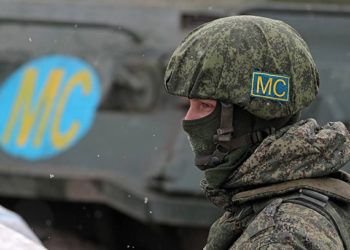 Russian “peacekeepers” display their MC markings, a cyrillic abbreviation of the Russian words миротворческие силы, or peacekeeping forces. By Alexander Ryumin/TASS
