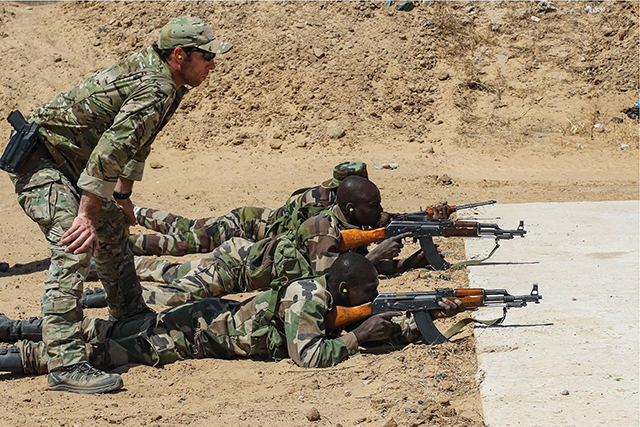 A US Army Special Forces weapons sergeant observes a Niger Army soldier during marksmanship training as part of Exercise Flintlock 2017 in Diffa, Niger, February 28, 2017. Photo by US Army/SFC Christopher Klutts/AFRICOM