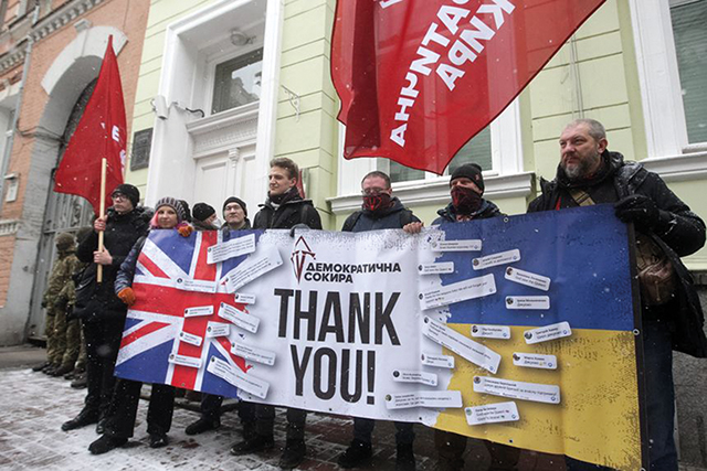 Ukrainians hold a banner during a rally to thank the UK for supplying Ukraine with weapons, outside the UK Embassy in Kyiv. Source: STR/ZUMA PRESS