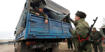 Pro-Russian troops in the separatist-controlled settlement of Mykolaivka, Ukraine, on March 1, 2022. Photo by Alexander Ermochenko/Reuters