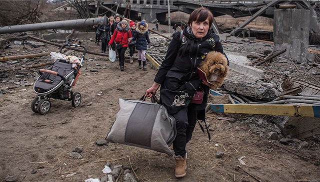 After four weeks of war in Ukraine more than 2 million people have fled into neighboring European nations seeking asylum and over 20,000 foreign volunteers have entered the country. Photo by Oleksandr Ratushniak/AP