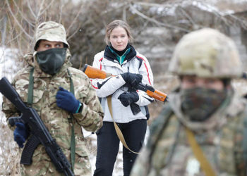 Civilian volunteers taking part in military exercises on the outskirts of Kyiv in Ukraine. By Valentyn Ogirenko/Reuters