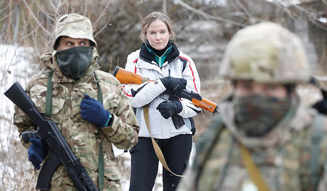 Civilian volunteers taking part in military exercises on the outskirts of Kyiv in Ukraine. By Valentyn Ogirenko/Reuters