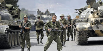 2008, Russian soldiers block the road on the outskirts of Gori, northwest of the capital Tbilisi, Georgia. Photo by Darko Bandic?AP