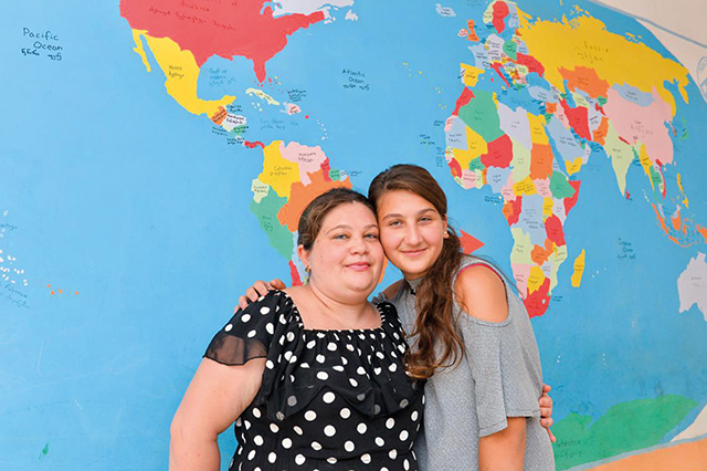 Kristine and her mother at school. UNICEF/GEO-2021/Turabelidze
