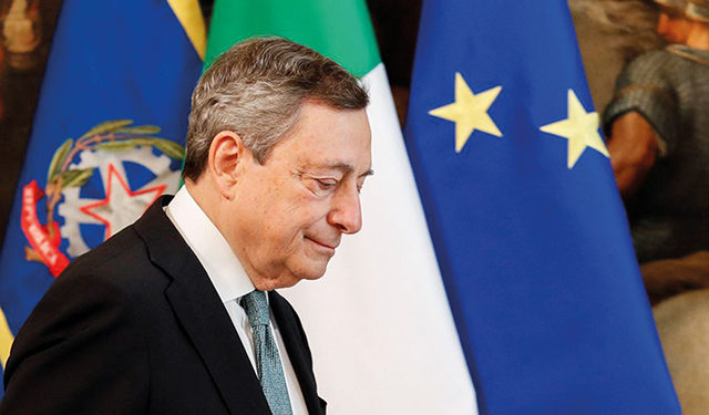 Italian Prime Minister Mario Draghi leaves at the end of his statement on the Ukraine crisis, in Rome, Italy, February 24, 2022. By Remo Casilli/REUTERS/Pool