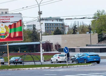 A billboard in Tiraspol, the self-proclaimed capital of Transnistria, and a tank monument recognizing World War II. Photo by Charles Davis/Insider