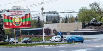 A billboard in Tiraspol, the self-proclaimed capital of Transnistria, and a tank monument recognizing World War II. Photo by Charles Davis/Insider