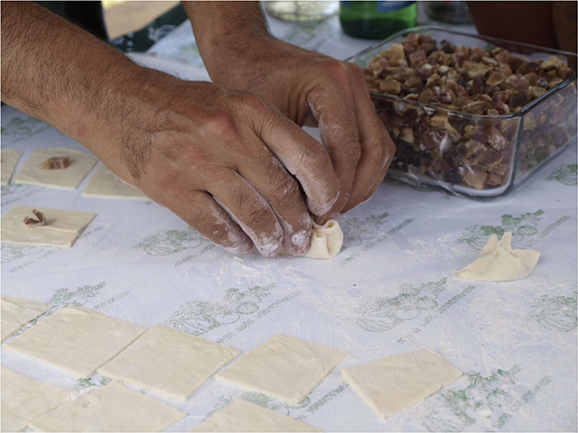 Tiny ‘apokhti khinkali’ being constructed at the Elkana farm with dough made from their local grain variants. Photo by Mike Godwin