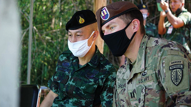 U.S. Army SFAB Captain Matthew Orders observes a training event alongside Royal Thai Army Colonel Aekanan Hemabut. Photo by Staff Sgt. John David Vilca/US Army