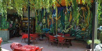Marleta's Farm is a sophisticated, artsy venue full of gigantic murals, an open cafe, a pool, and a library with a breathtaking view of the snow-topped Caucasus Mountains