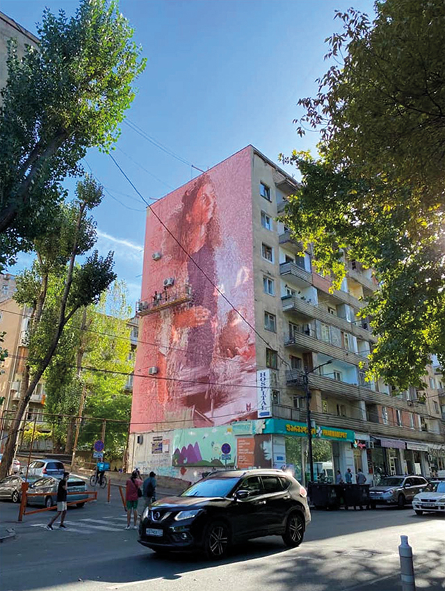 Tbilisi Mural Fest 2022 Fintan Magee Working on His Artwork on 12 Bakhtrioni St. Source: Tbilisi Mural Fest 