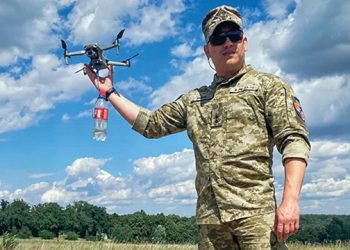 Ukrainian Lieutenant Anton Galyashinskiy holds a drone used for carrying explosives during a practice session on the outskirts of Kyiv. By Ionut Iordachescu/AFP via Getty Images