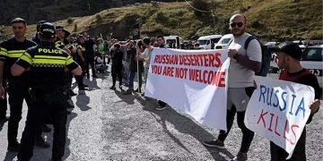 Protestors gather near the Lars border checkpoint with Russia opposing the immigration of Russian citizens. Source: AFP