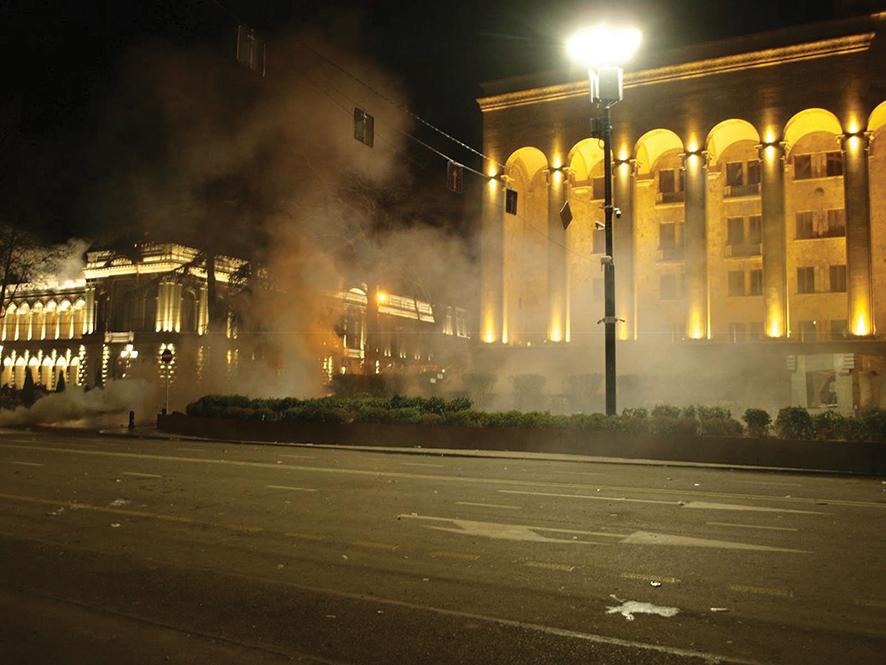 A massive cloud of CS gas looms over the square in front of Georgia’s Parliament building. Photo by Mike Godwin