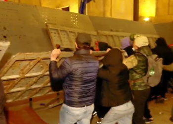 Protesters attack parliament entrances, police