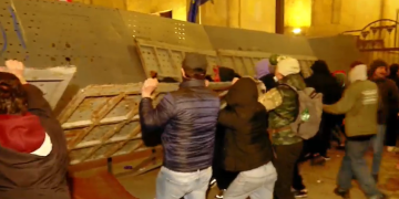 Protesters attack parliament entrances, police