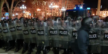 Police form new line, with water cannon, near Liberty Square, Parliament