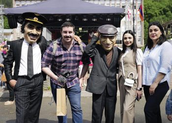 Anna Margaryan, Public Relations Manager from the Armenian Tourism Committee (second from right), and Alla Ghazaryan, Project Coordinator from Strategic Development Agency (far right) pose at the festival with Mimino characters. Photo by the Tourism Committee of the Republic of Armenia