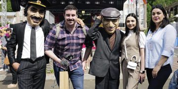 Anna Margaryan, Public Relations Manager from the Armenian Tourism Committee (second from right), and Alla Ghazaryan, Project Coordinator from Strategic Development Agency (far right) pose at the festival with Mimino characters. Photo by the Tourism Committee of the Republic of Armenia