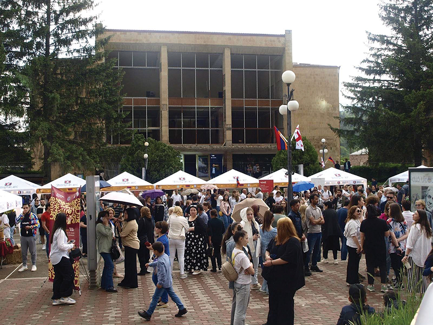 Festival goers and booths line the streets in Dilijan. (Photo by Mike Godwin)
