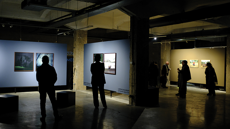 People looking at various exhibits during the opening night of Meeting Point: Mountains. Image by Shako Devdariani
