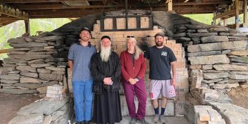 Dee and friends with Bishop Isaiah