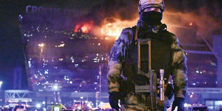 Russian security forces outside the burning entertainment center in Moscow, Russia. Source: AP Photo