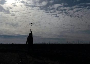 A Ukrainian serviceman catches a drone at the front line, not far from Bakhmut. Photo by Alex Babenko/AP Photo