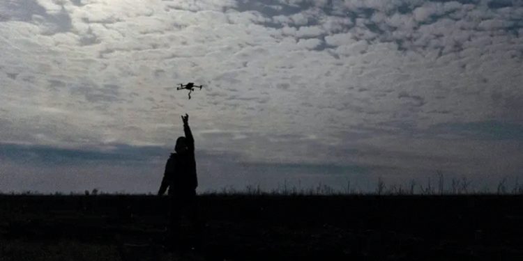 A Ukrainian serviceman catches a drone at the front line, not far from Bakhmut. Photo by Alex Babenko/AP Photo