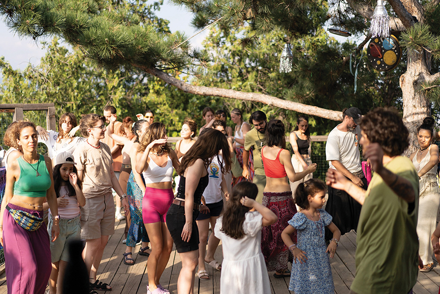 Attendees dancing with each other at Ertoba. Source: Lumos Yoga Studio