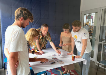 Participants working together to solve the first phase of the workshop