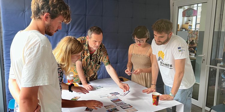 Participants working together to solve the first phase of the workshop