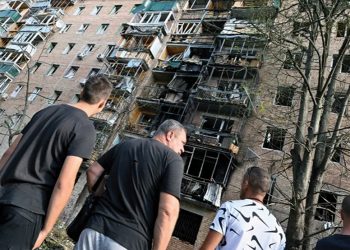 A multistory residential building in Kursk, Russia, was hit, according to local authorities, by debris from a destroyed Ukrainian missile in the course of the Russia-Ukraine conflict. Source: Anatoliy Zhdanov/Kommersant Photo via Reuters