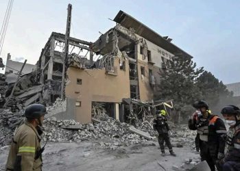 Rescue workers sifting through the ruins of a hotel following another wave of strikes in Kryvyi Rih. Source: REUTERS