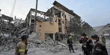 Rescue workers sifting through the ruins of a hotel following another wave of strikes in Kryvyi Rih. Source: REUTERS