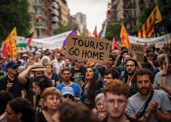 Demonstrators march shouting slogans in downtown Barcelona. Source: AP