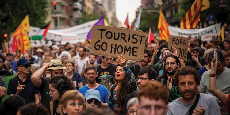 Demonstrators march shouting slogans in downtown Barcelona. Source: AP