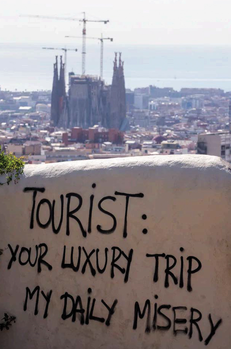 Anti-tourist graffiti seen at the Guell Park in Barcelona. Source: EPA