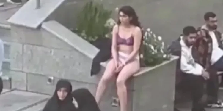 Iranian woman who stripped in anti-hijab protest released without charges