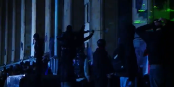 Protesters and riot police in standoff on parliament steps