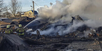 Emergency services personnel work to extinguish a fire following a Russian rocket attack in Ukraine. Source: France 24
