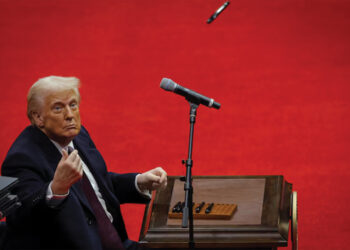 President Trump looks on after signing executive orders inside the Capital One Arena. REUTERS/Brian Snyder