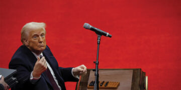 President Trump looks on after signing executive orders inside the Capital One Arena. REUTERS/Brian Snyder